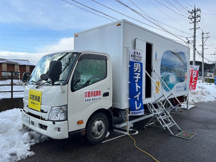 Self-propelled flush toilet car on display